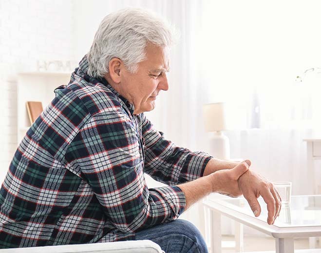 elderly man with shaking hand